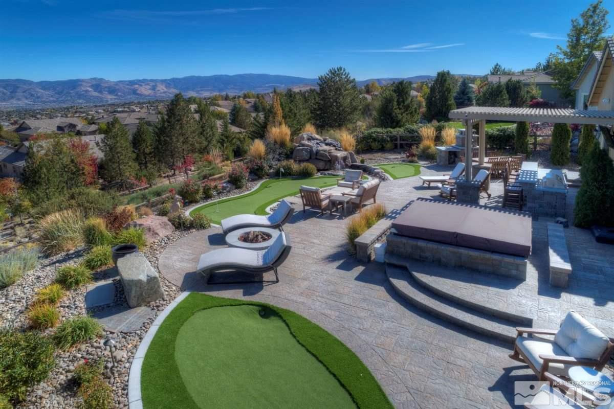 544 Echo Ridge Court Reno, NV 89511 - Photo 26 of 39 a view of a swimming pool with a patio