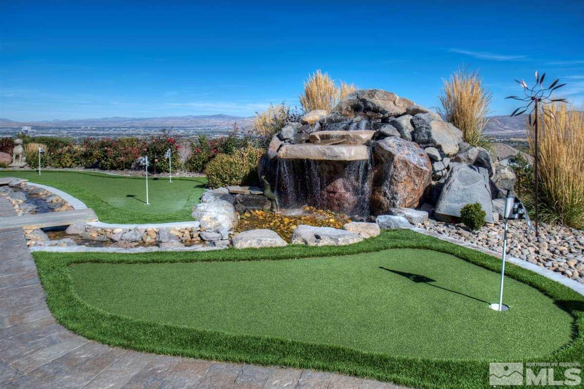 544 Echo Ridge Court Reno, NV 89511 - Photo 28 of 39 a view of a swimming pool with a garden