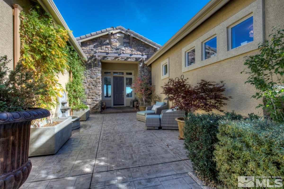 544 Echo Ridge Court Reno, NV 89511 - Photo 3 of 39 a front view of a house with outdoor seating and plants