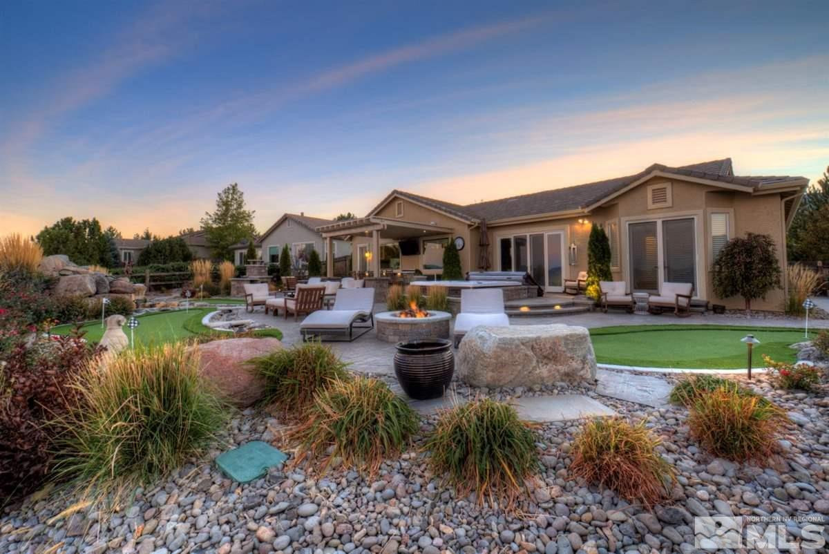 544 Echo Ridge Court Reno, NV 89511 - Photo 31 of 39 a view of a house with a yard and a garden