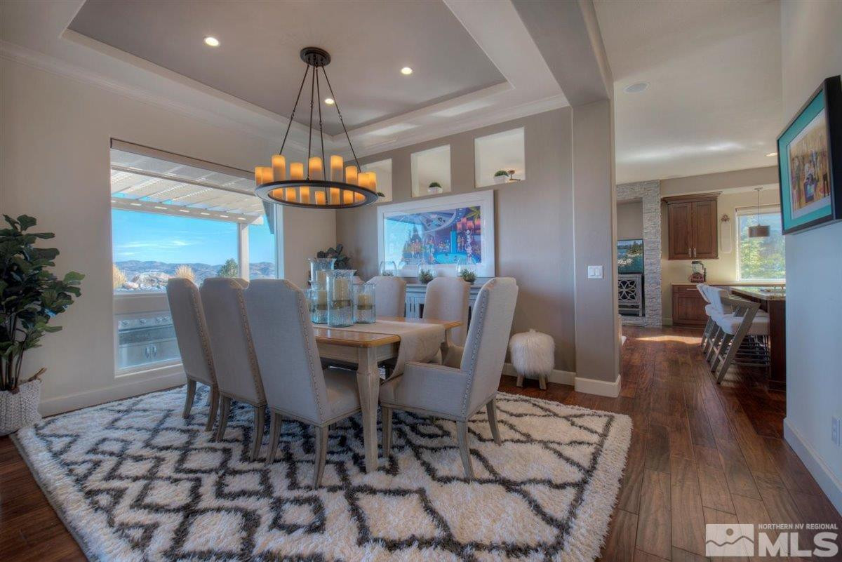 544 Echo Ridge Court Reno, NV 89511 - Photo 7 of 39 a view of a dining room with furniture window and wooden floor