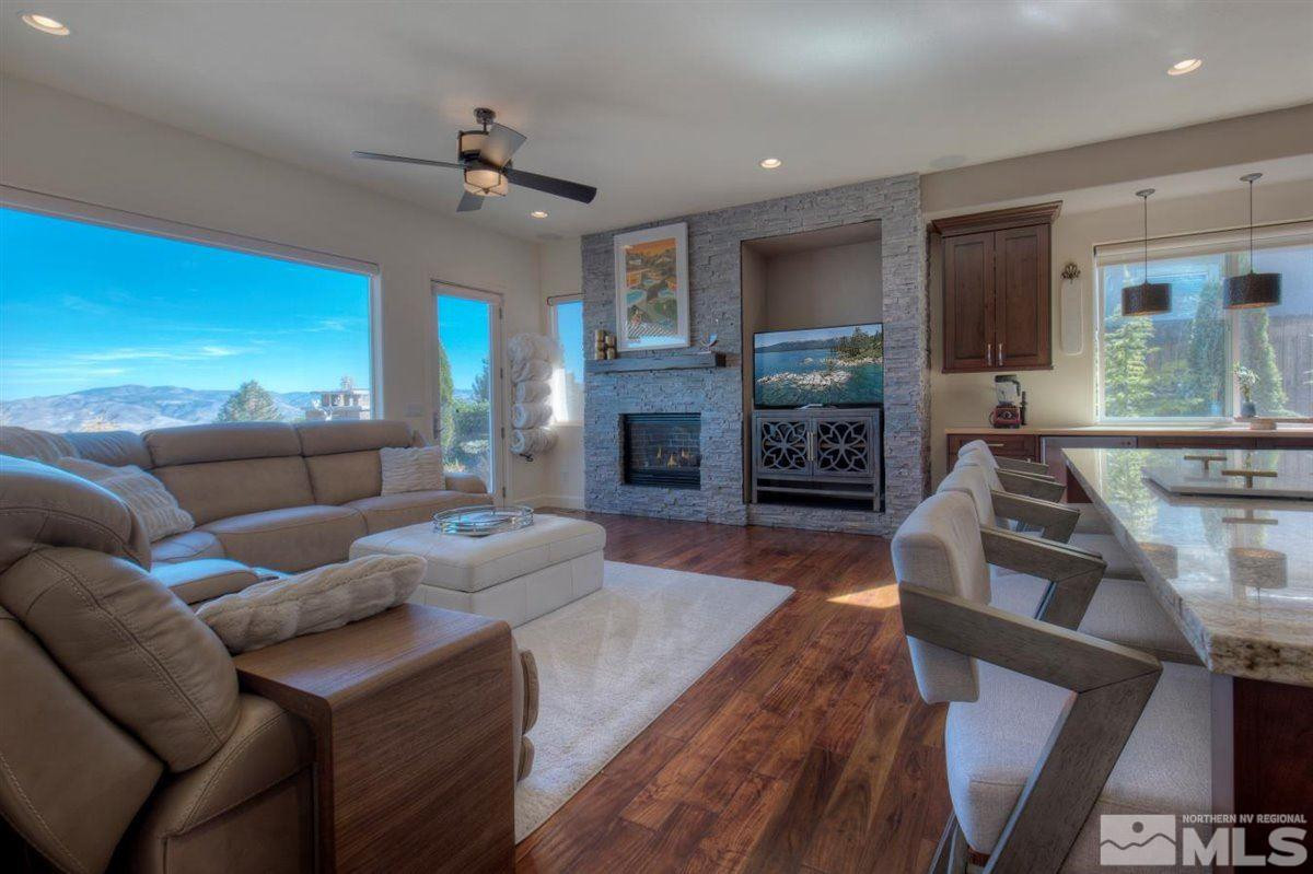 544 Echo Ridge Court Reno, NV 89511 - Photo 8 of 39 a living room with fireplace furniture and a wooden floor