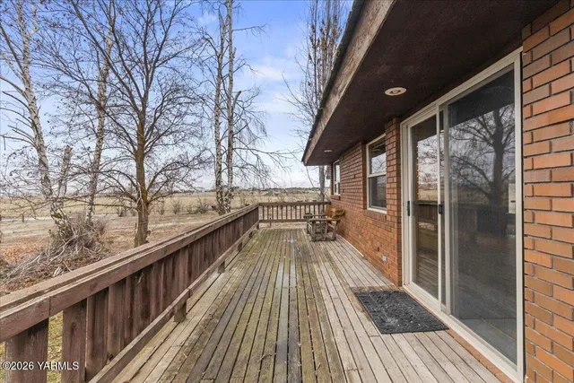 a view of balcony with wooden floor
