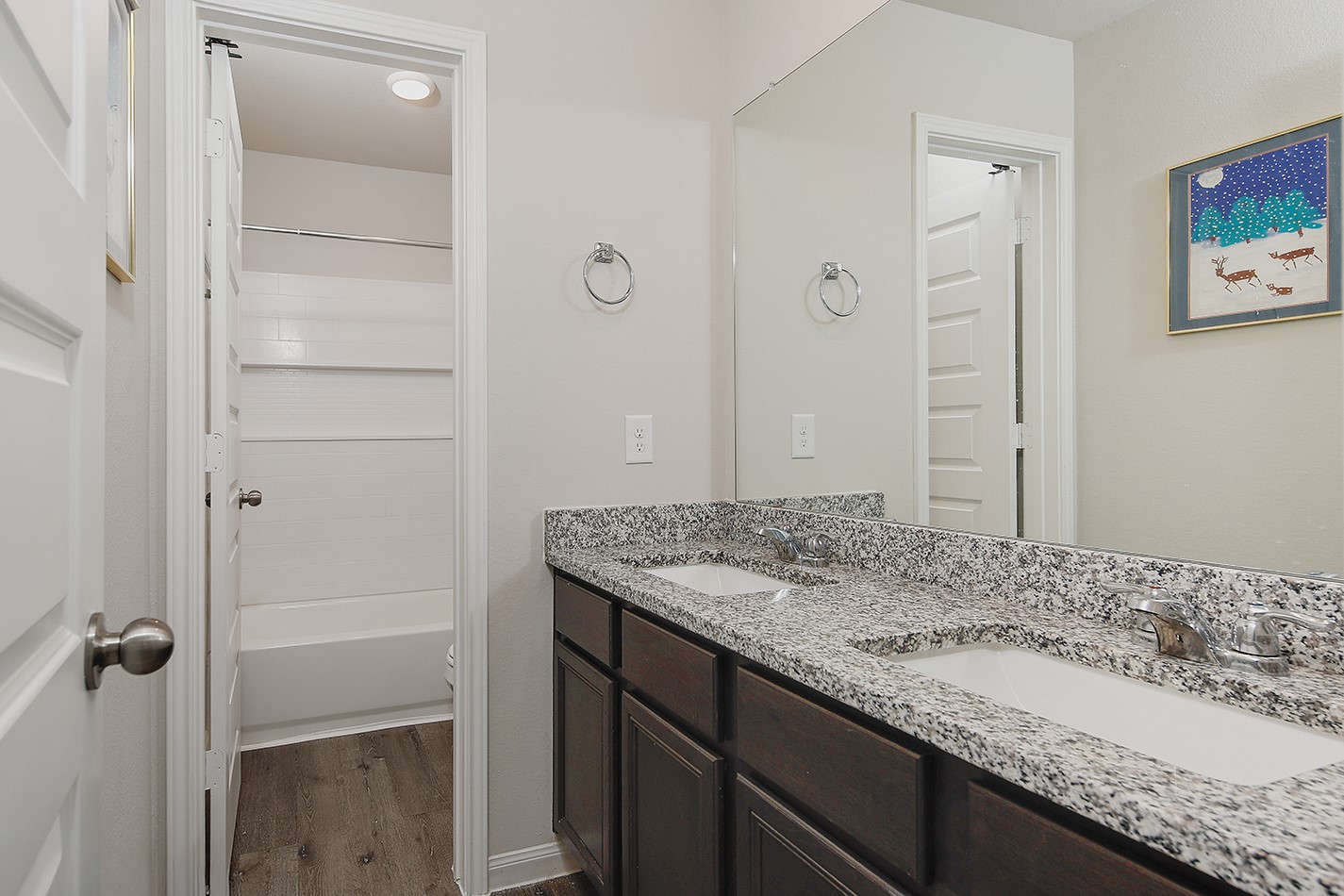 14022 Chinook Drive Conroe, TX 77384 - Photo 21 of 25 a bathroom with a granite countertop sink and a mirror