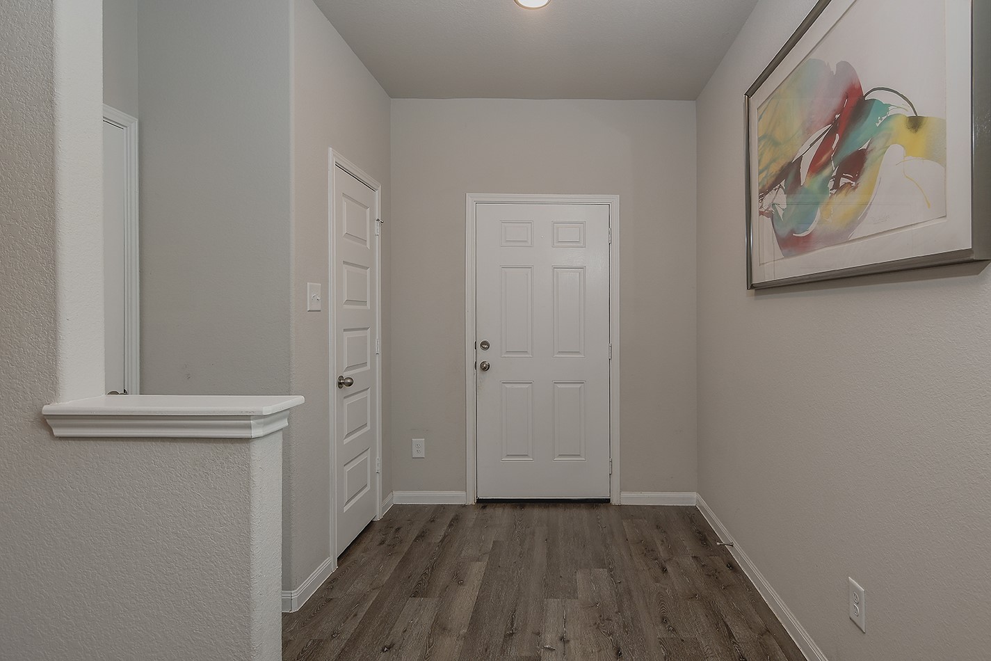 14022 Chinook Drive Conroe, TX 77384 - Photo 3 of 25 a view of an empty room with wooden floor and a window
