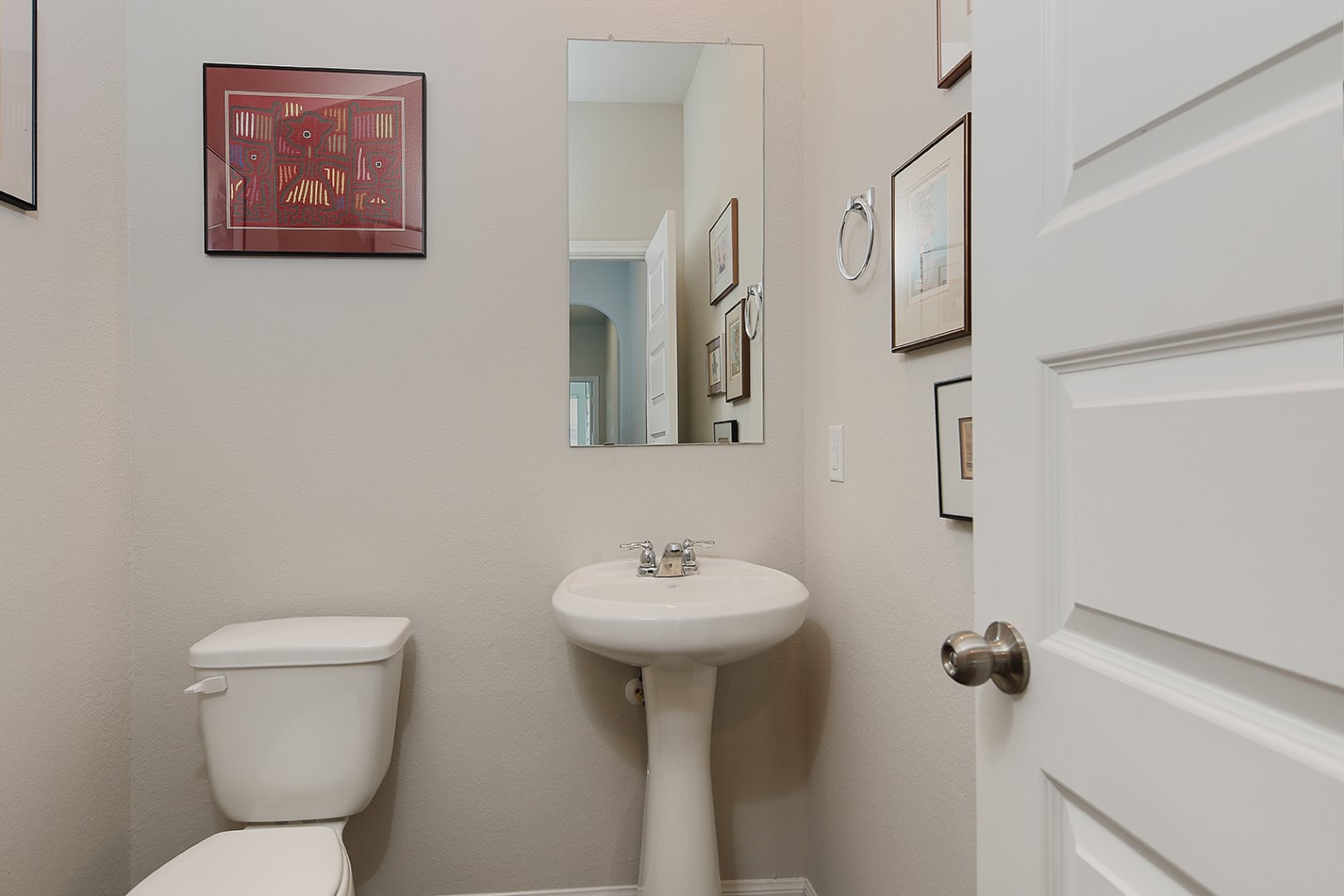 14022 Chinook Drive Conroe, TX 77384 - Photo 10 of 25 a bathroom with a toilet sink and mirror