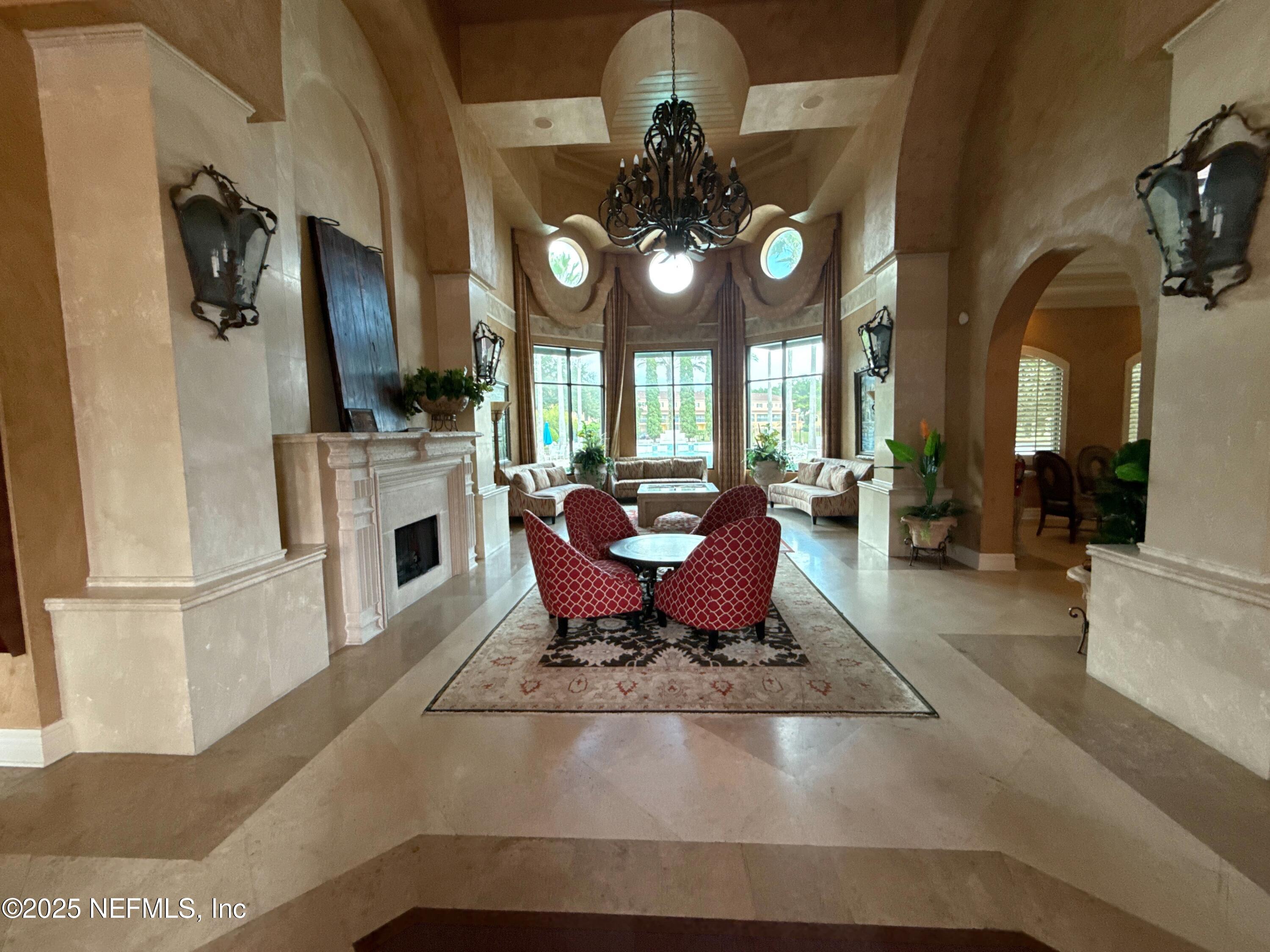 9745 Touchton Road, Unit 1725 Jacksonville, FL 32246 - Photo 14 of 20 a living room with fireplace furniture and a fireplace
