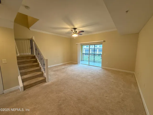 a view of empty room with windows