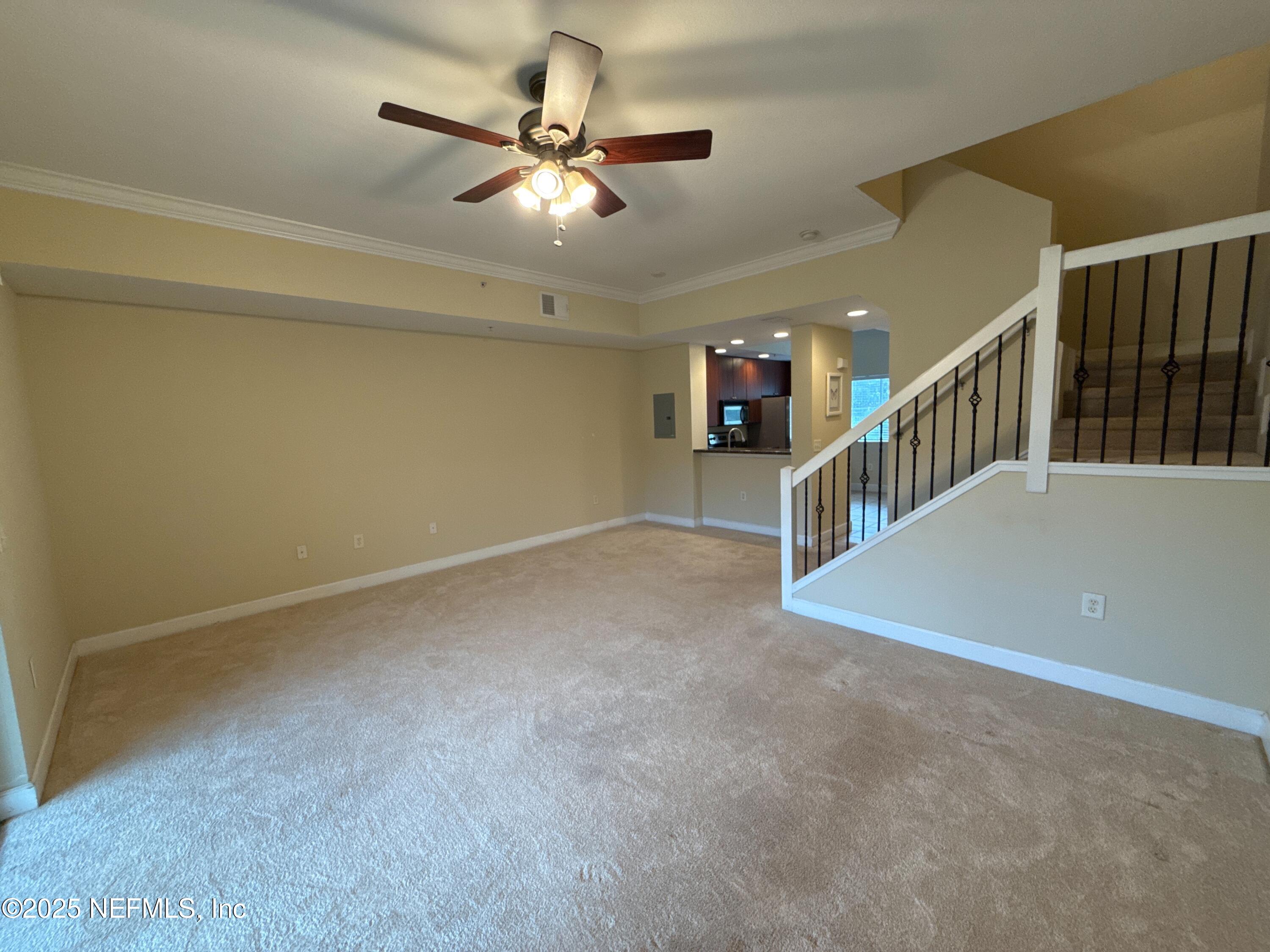 9745 Touchton Road, Unit 1725 Jacksonville, FL 32246 - Photo 7 of 20 a view of an empty room with stairs
