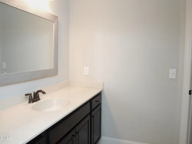 a bathroom with a sink and a vanity