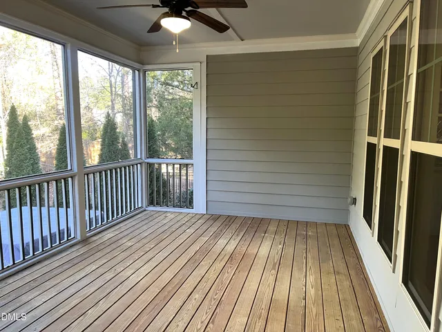 a view of balcony with wooden floor
