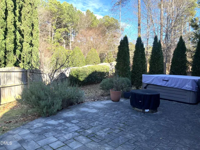 a view of patio with a yard