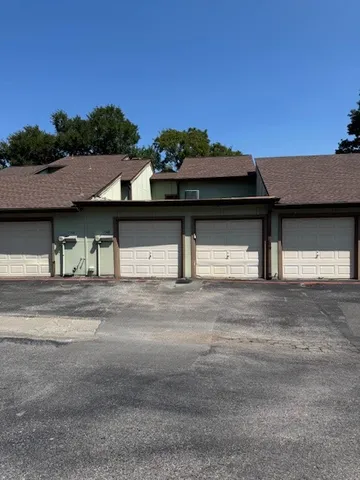 a view of a house with a street