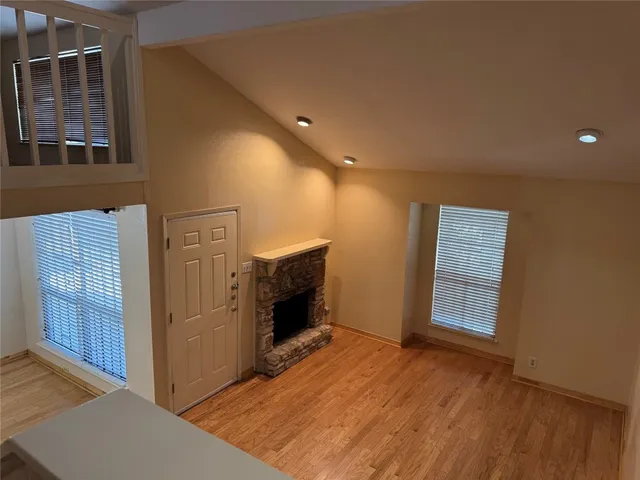 a view of livingroom with furniture and a fireplace