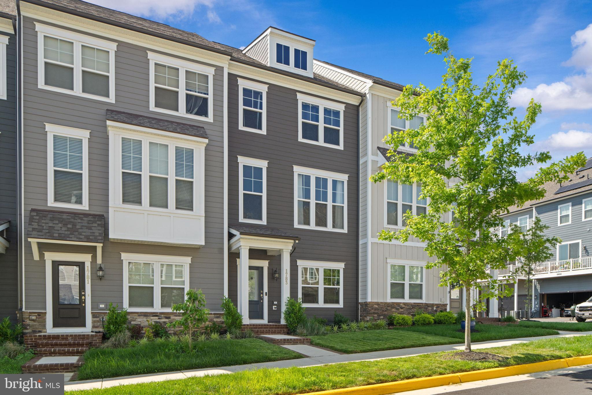 1783 Hickory Woods Road Dumfries, VA 22026 - Photo 1 of 54 a front view of a house with a yard