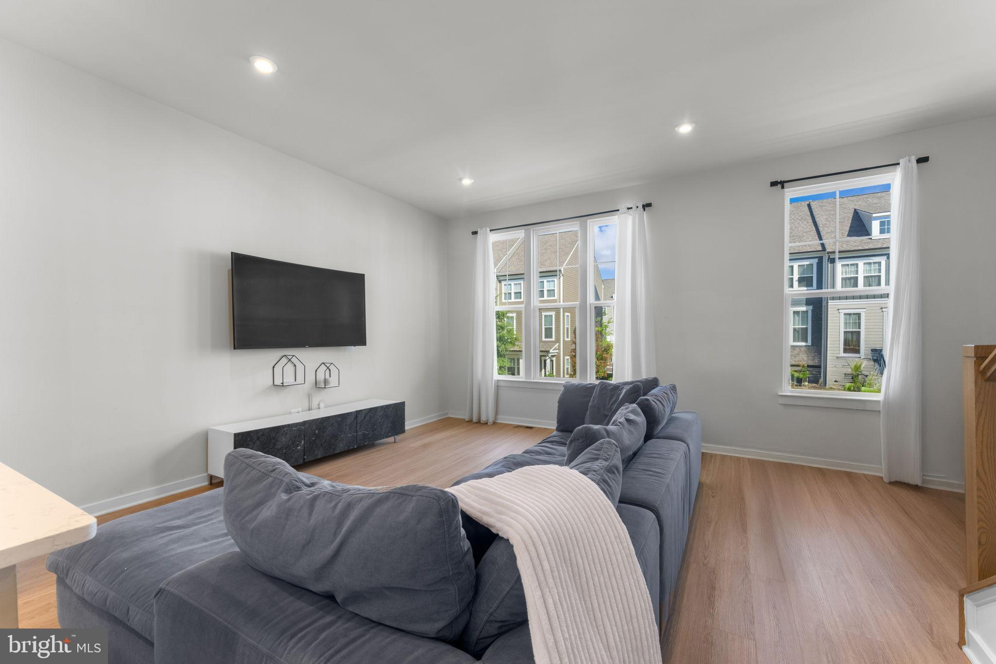 1783 Hickory Woods Road Dumfries, VA 22026 - Photo 11 of 54 a living room with furniture and a flat screen tv