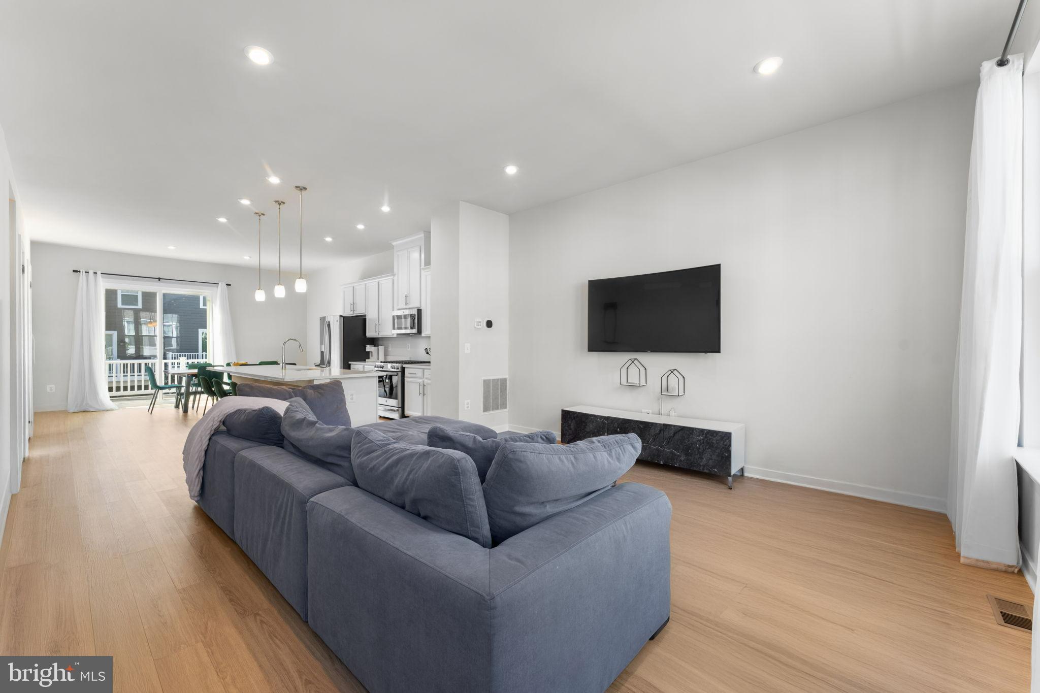 1783 Hickory Woods Road Dumfries, VA 22026 - Photo 12 of 54 a living room with furniture and a flat screen tv