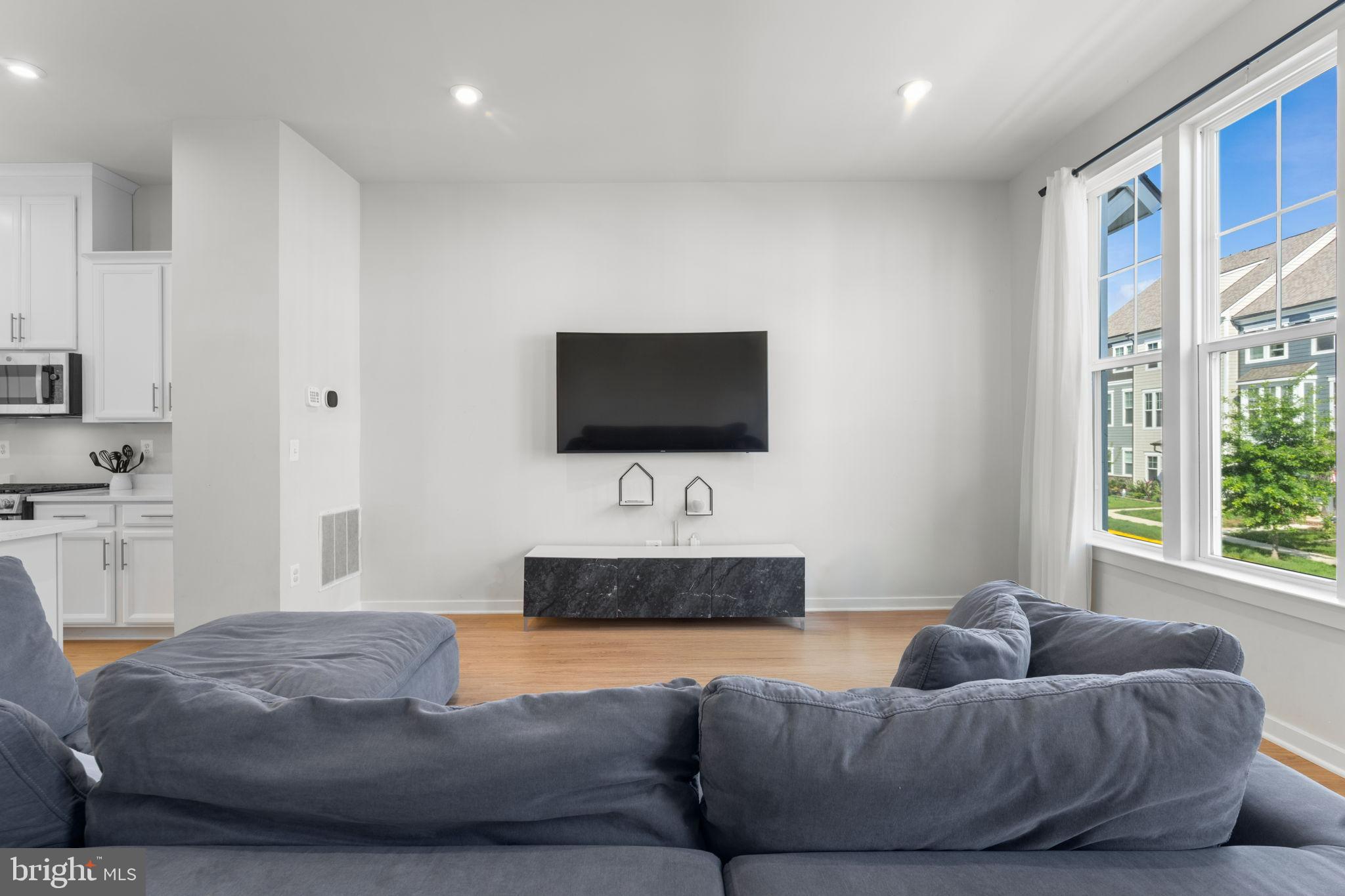 1783 Hickory Woods Road Dumfries, VA 22026 - Photo 13 of 54 a living room with furniture and a flat screen tv