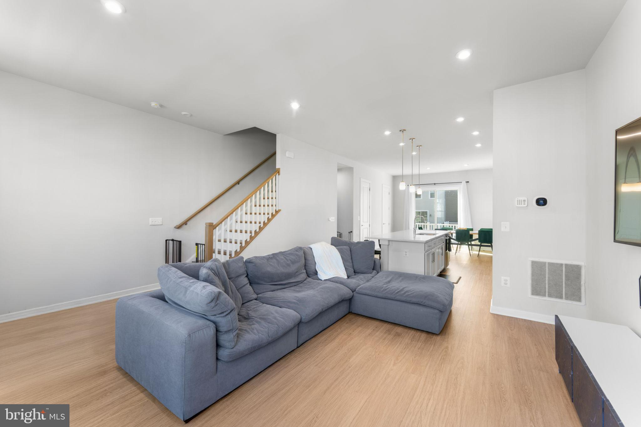 1783 Hickory Woods Road Dumfries, VA 22026 - Photo 15 of 54 a living room with furniture and a wooden floor