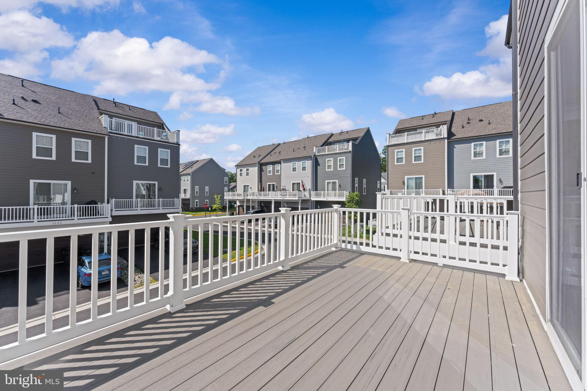 1783 Hickory Woods Road Dumfries, VA 22026 - Photo 17 of 54 a view of a brick building from a balcony