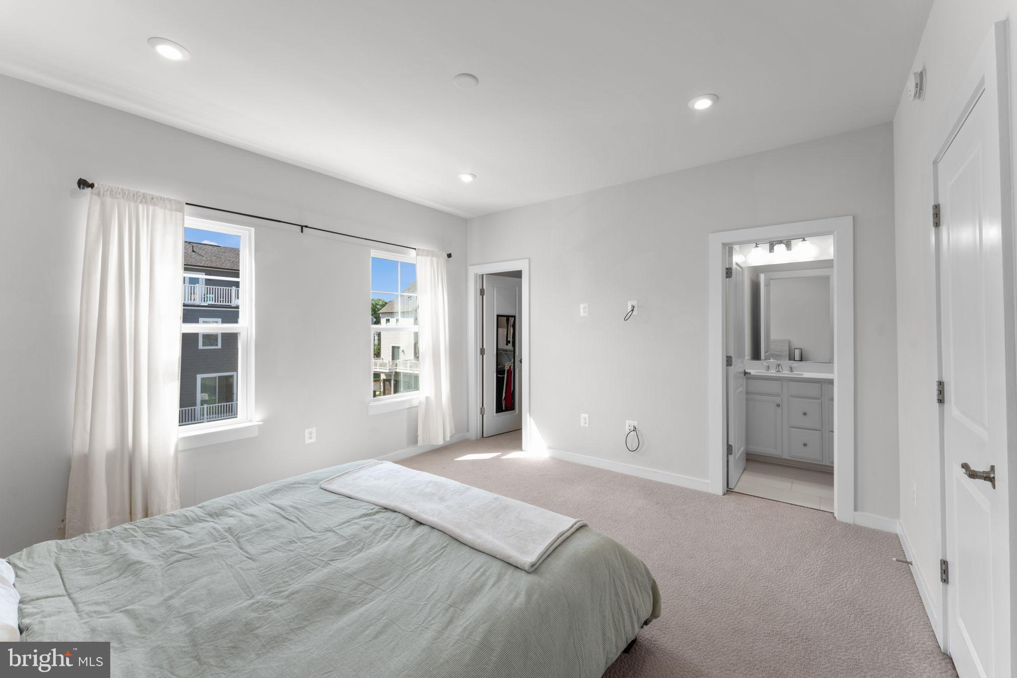 1783 Hickory Woods Road Dumfries, VA 22026 - Photo 22 of 54 a bedroom with a large bed and chandelier