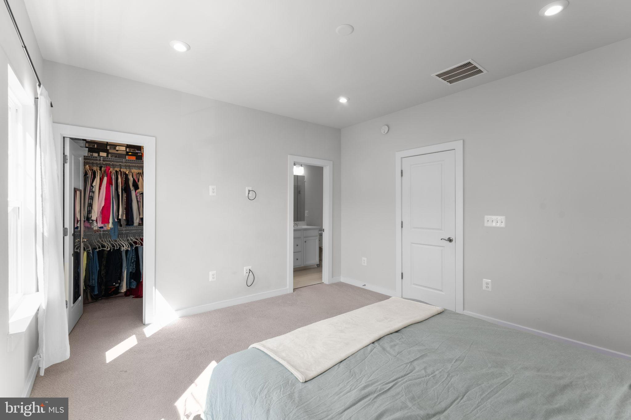 1783 Hickory Woods Road Dumfries, VA 22026 - Photo 23 of 54 a spacious bedroom with a bed and a view of bathroom