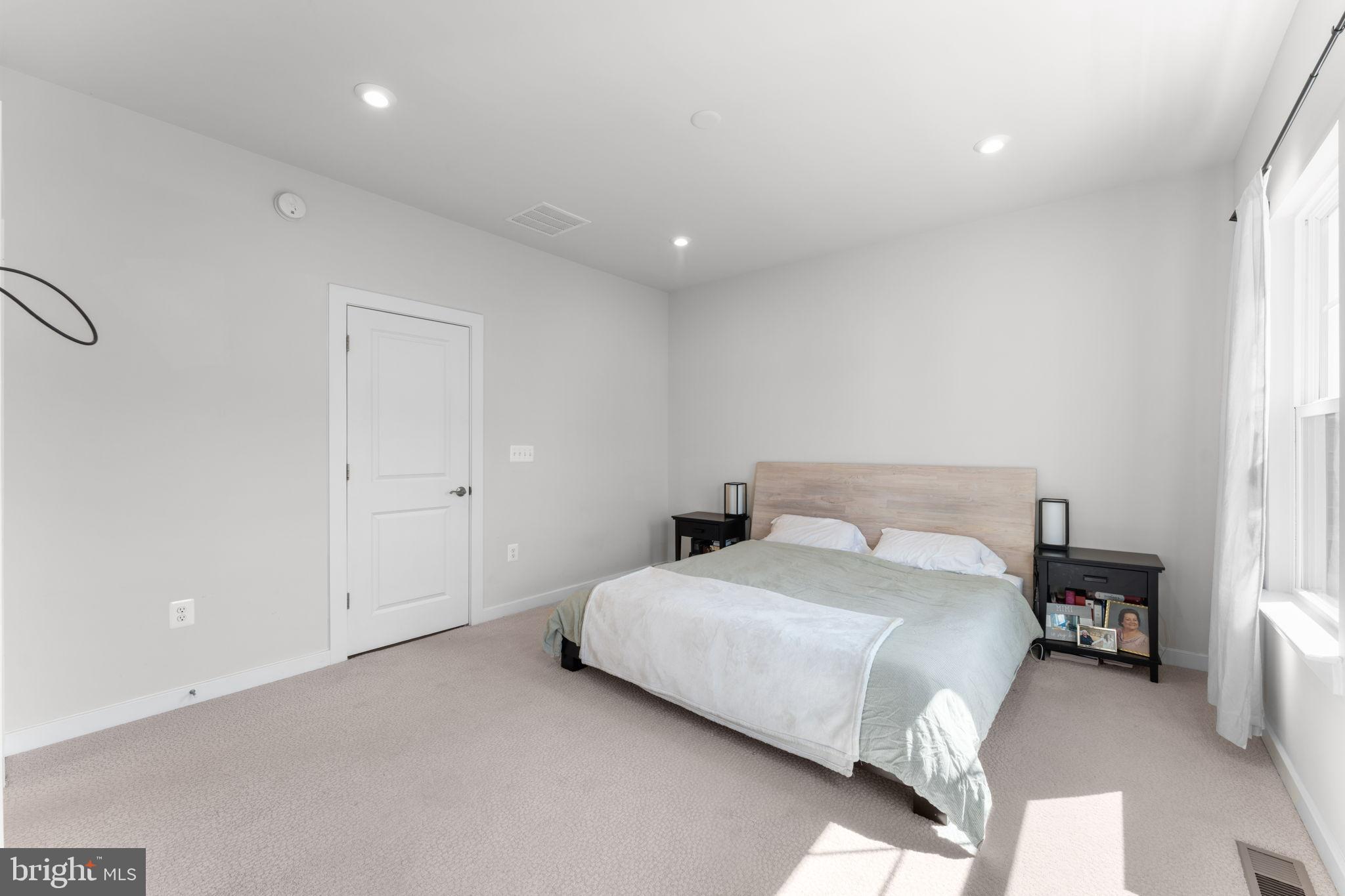 1783 Hickory Woods Road Dumfries, VA 22026 - Photo 25 of 54 a bedroom with a bed and a window