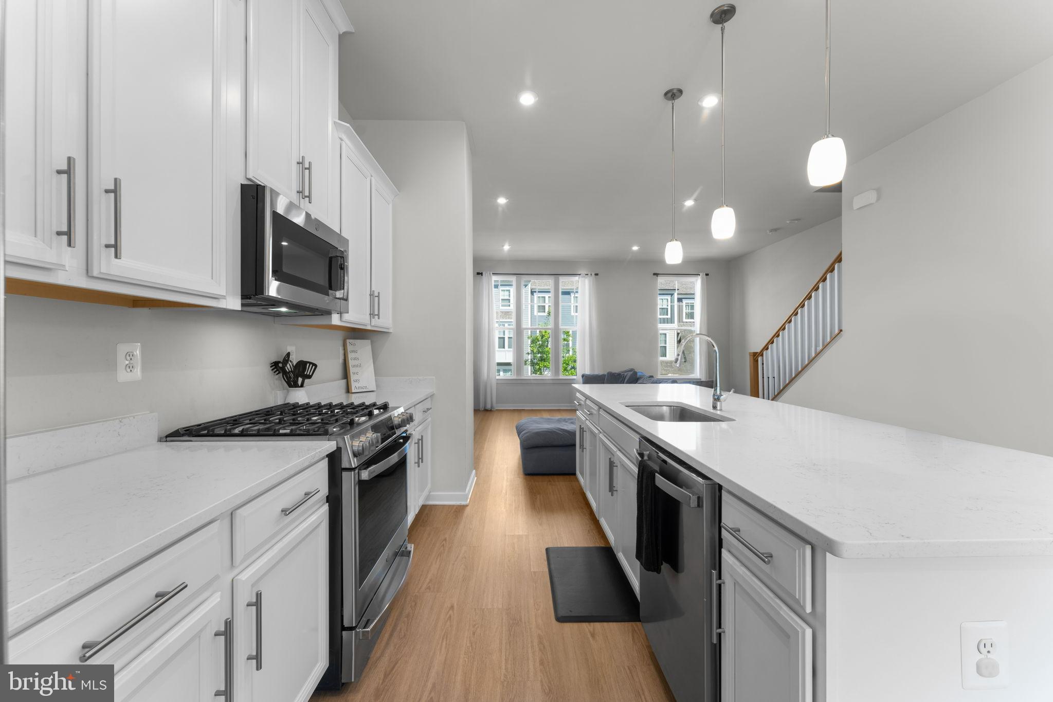 1783 Hickory Woods Road Dumfries, VA 22026 - Photo 3 of 54 a kitchen with a sink stove and microwave