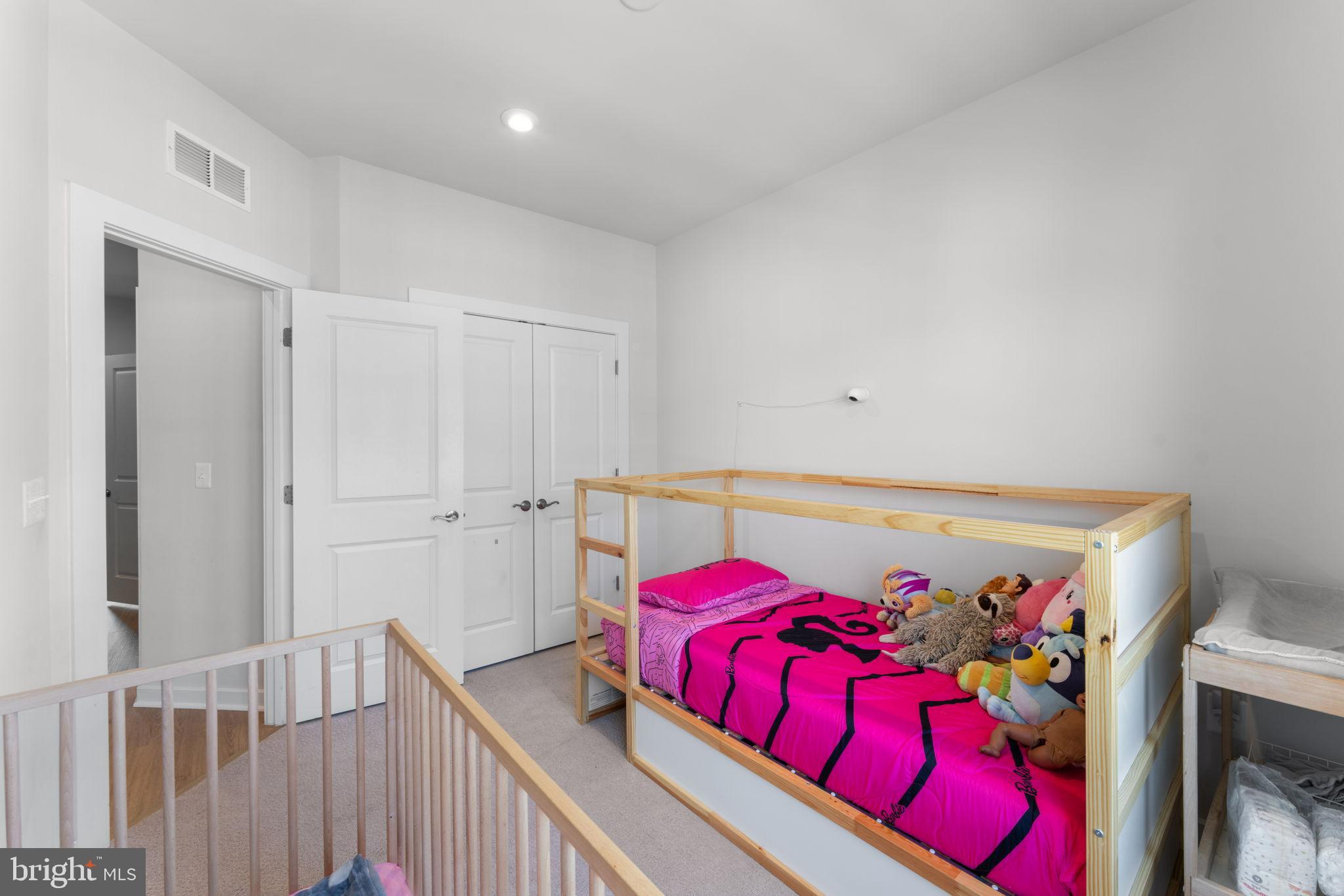 1783 Hickory Woods Road Dumfries, VA 22026 - Photo 31 of 54 a view of a bedroom with a bed and a couch