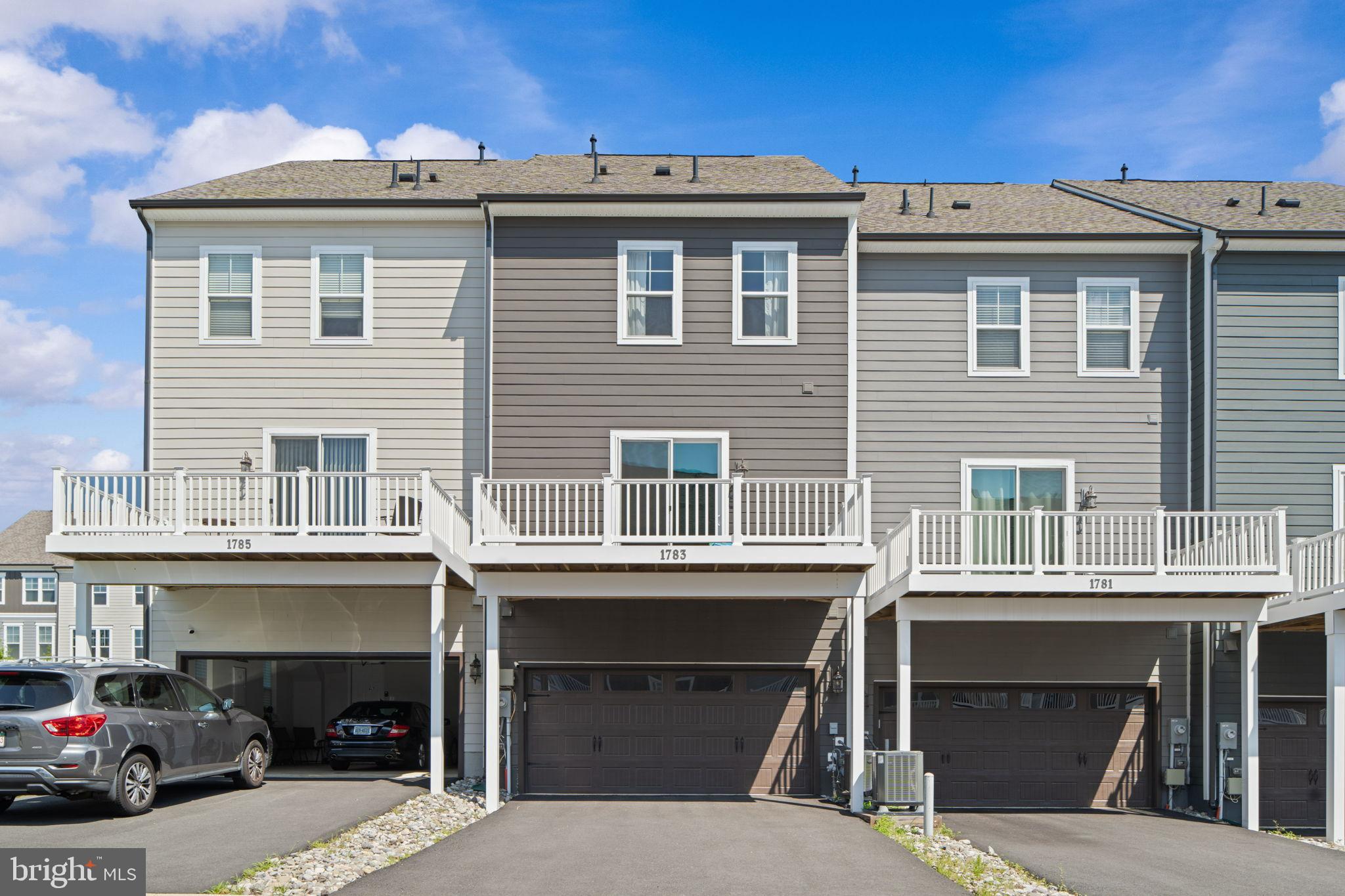 1783 Hickory Woods Road Dumfries, VA 22026 - Photo 37 of 54 a view of a car park in front of a building