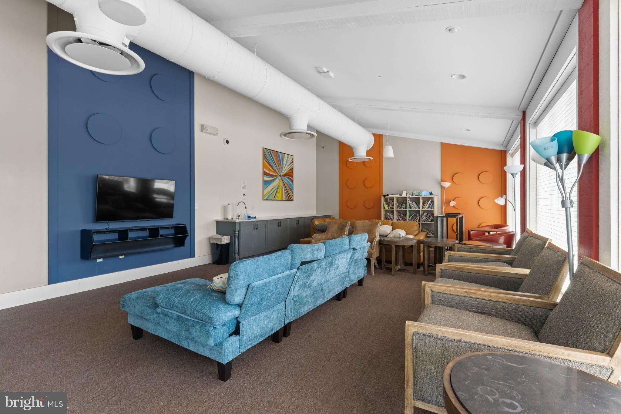 1783 Hickory Woods Road Dumfries, VA 22026 - Photo 40 of 54 a living room with furniture and a flat screen tv