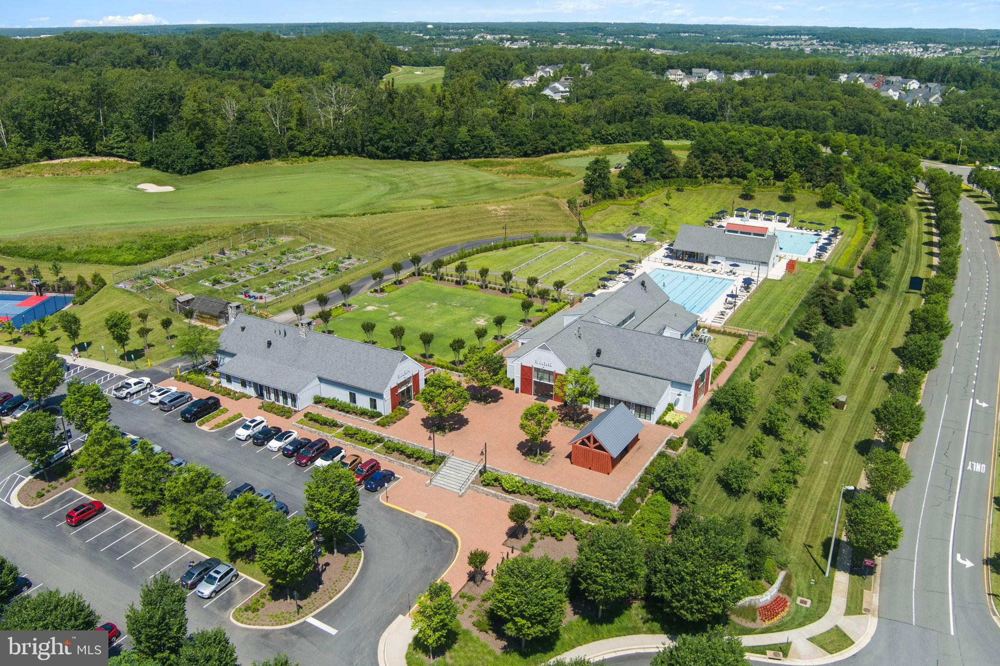 1783 Hickory Woods Road Dumfries, VA 22026 - Photo 44 of 54 an aerial view of a city with lots of residential buildings