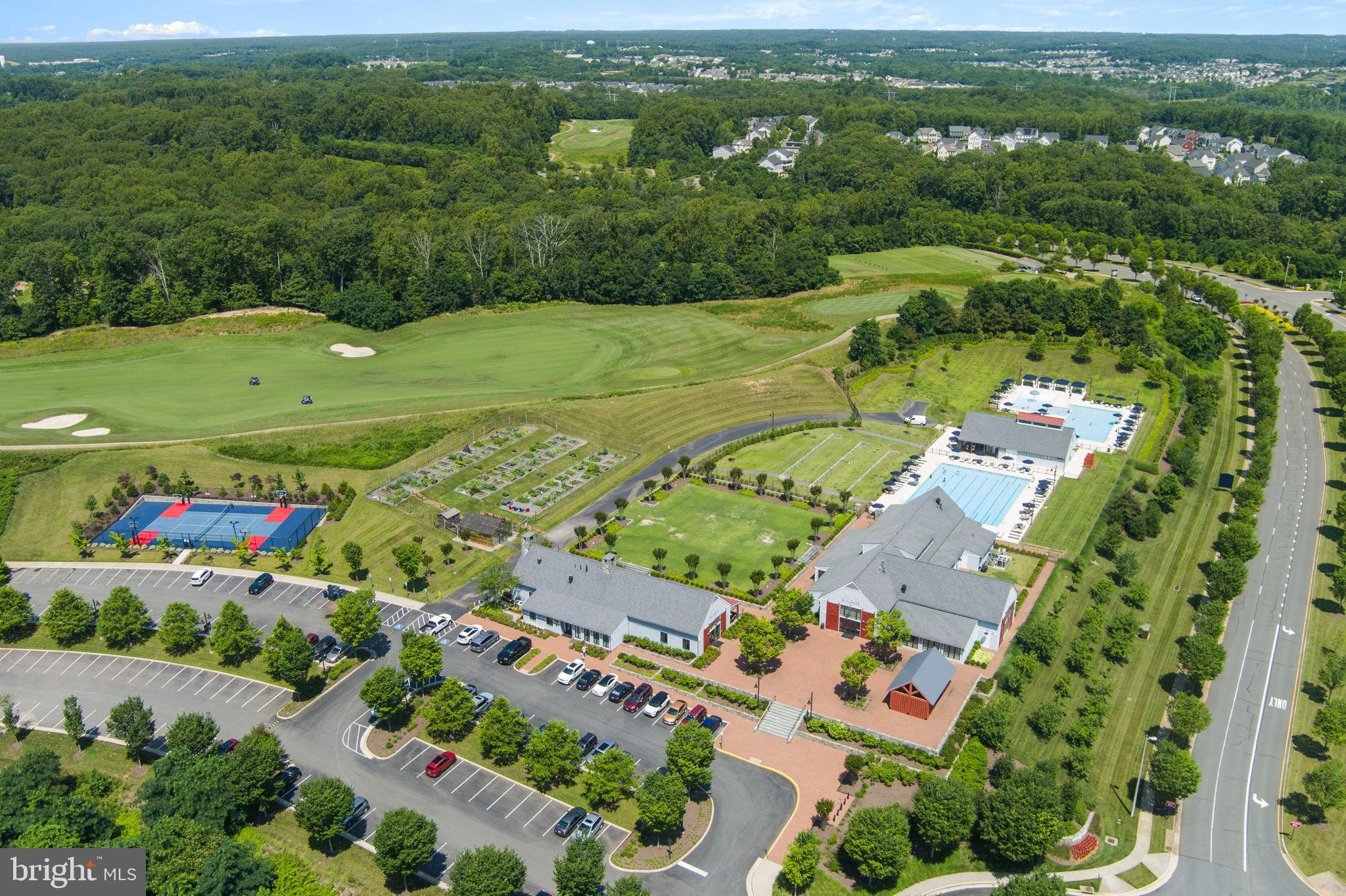 1783 Hickory Woods Road Dumfries, VA 22026 - Photo 45 of 54 an aerial view of a city with lots of residential buildings