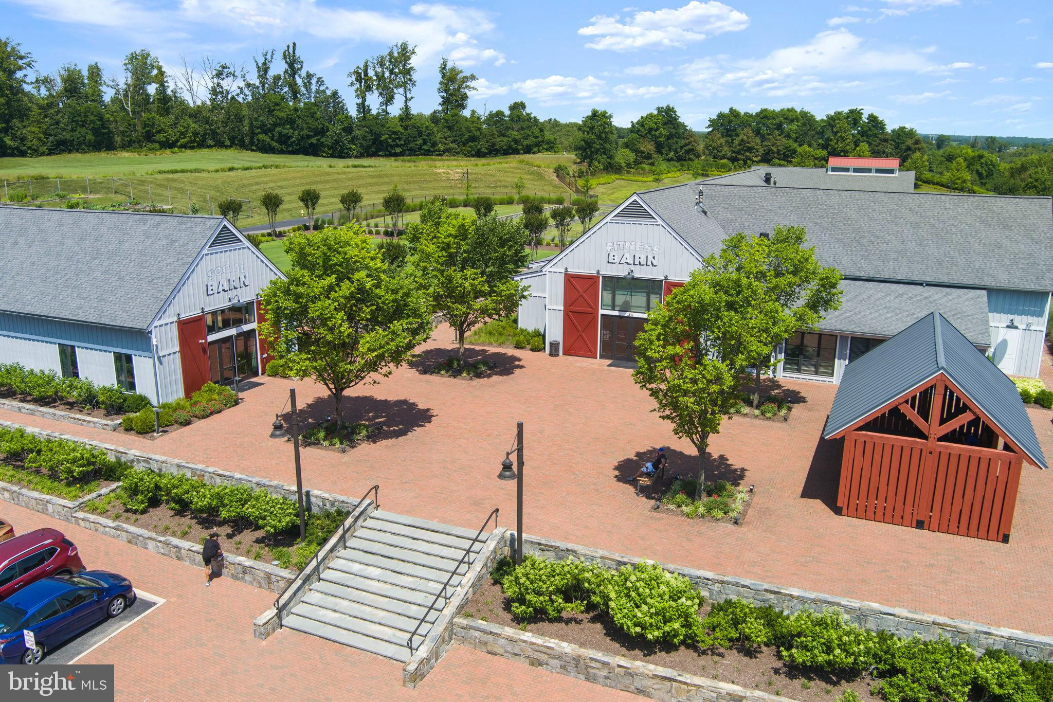 1783 Hickory Woods Road Dumfries, VA 22026 - Photo 53 of 54 an aerial view of a house with a garden and a yard