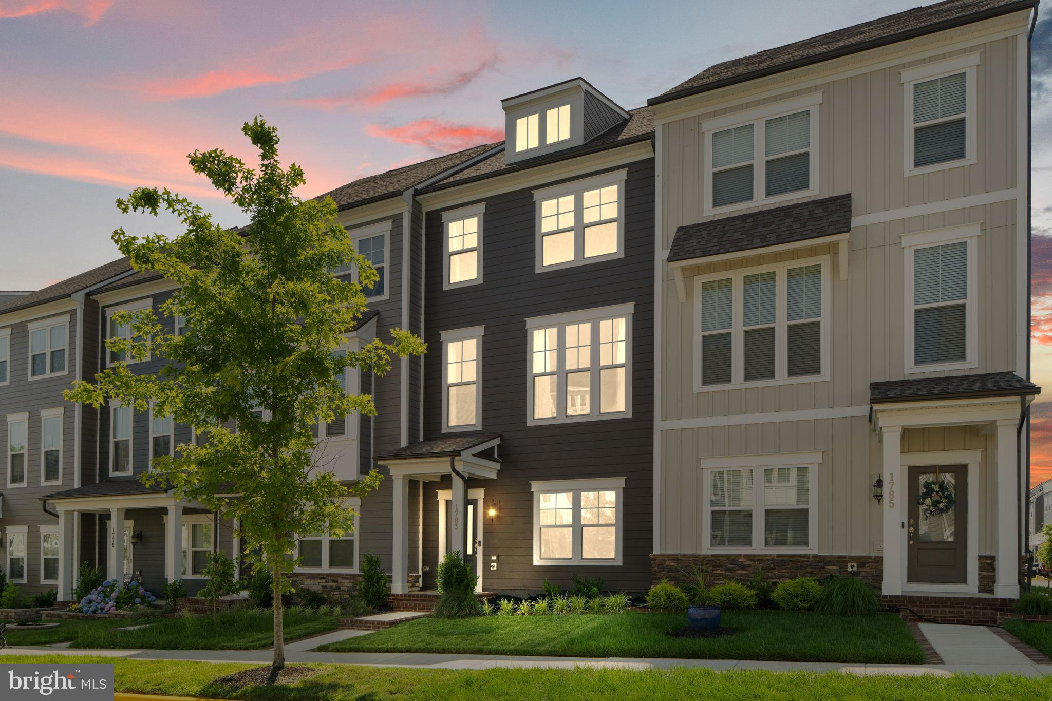 1783 Hickory Woods Road Dumfries, VA 22026 - Photo 54 of 54 a view of a brick building next to a yard