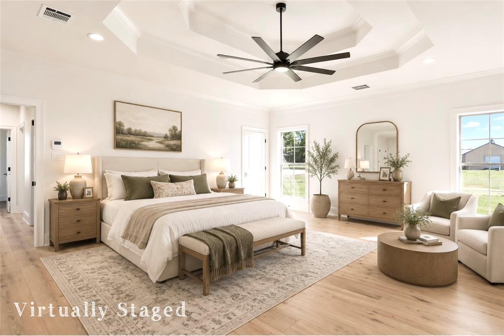6485 St John's Church Road Hosston, LA 71043 - Photo 20 of 39 a bedroom with a large bed and a chandelier