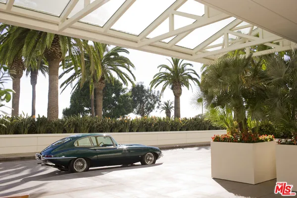 a backyard of a house with furniture and wooden floor