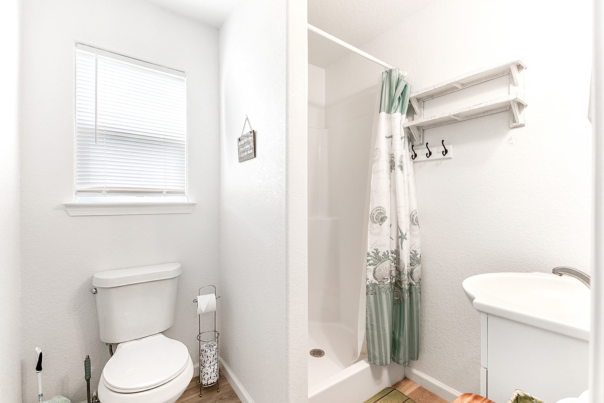 126 Nesmith Place Surfside Beach, TX 77541 - Photo 38 of 49 a white toilet sitting next to a bathroom sink