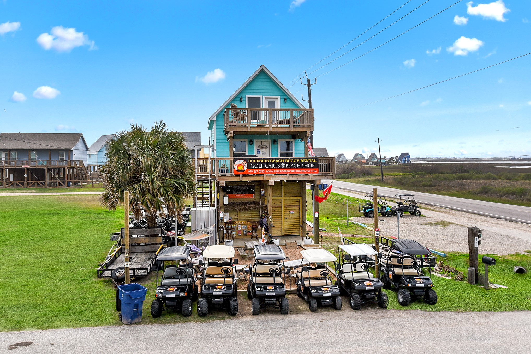 126 Nesmith Place Surfside Beach, TX 77541 - Photo 47 of 49 a roof deck with table and chairs a barbeque and potted plants