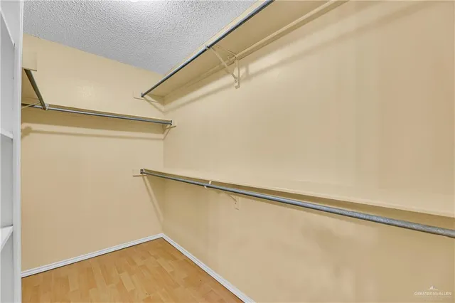 wooden floor in an empty room and a window