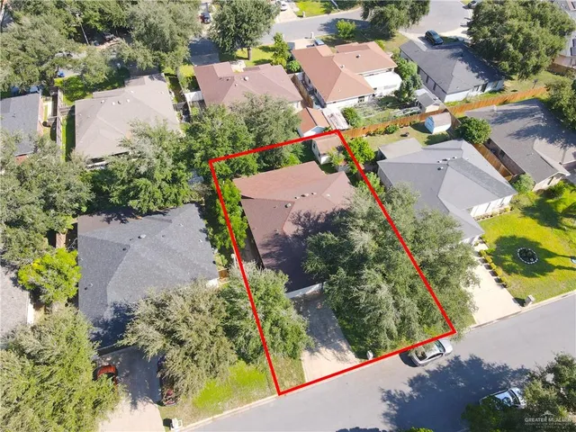 an aerial view of residential houses with outdoor space