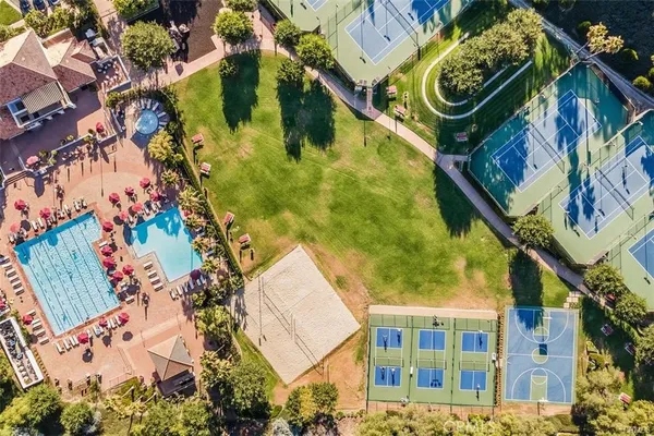 a view of a swimming pool with lounge chairs