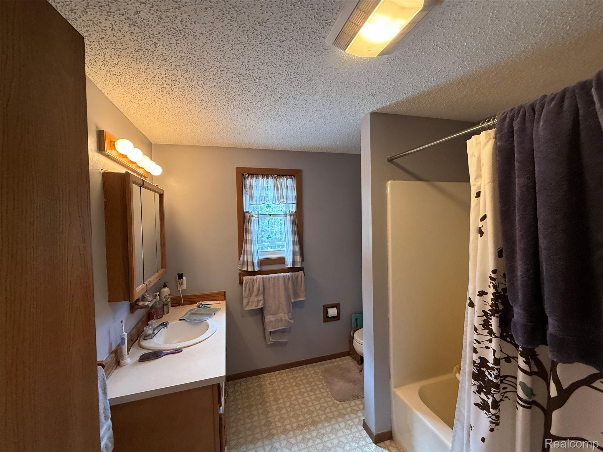 11245 Cedar Road Lake, MI 48632 - Photo 8 of 28 First floor bathroom
