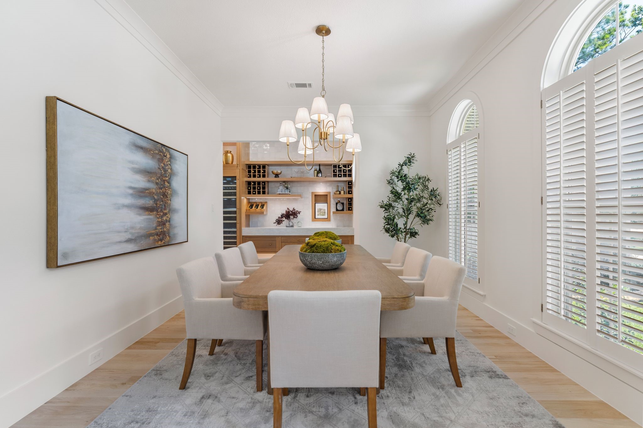 31 Hollymead Drive Spring, TX 77381 - Photo 9 of 50 This elegant dining room features stylish chandelier, and large arched windows with custom shutters. built-in 100+ bottle Thermador Wine cooler and custom wine racks.