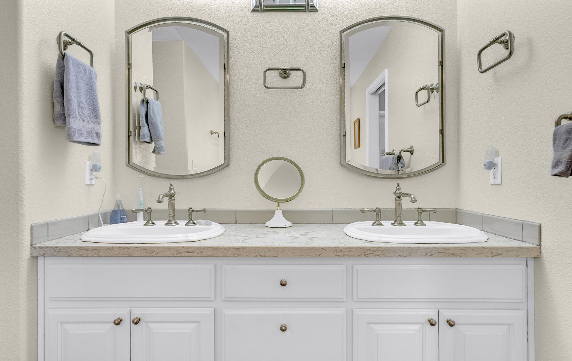 650 Wagon Road Chester, CA 96020 - Photo 13 of 36 a bathroom with double vanity sinks and two mirror