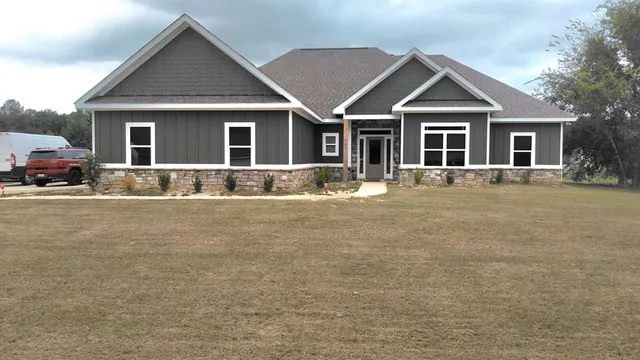 a front view of a house with a yard