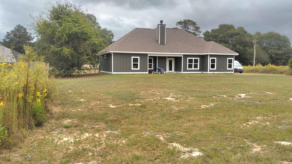 152 McLendon Road Fort Mitchell, AL 36856 - Photo 25 of 27 a front view of a house with a garden