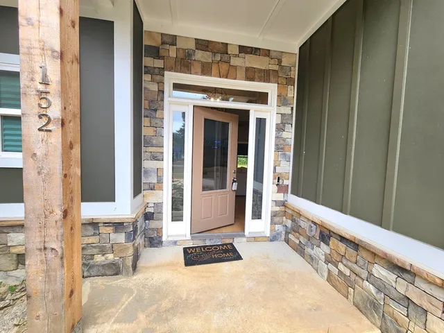 a front view of a house with a outdoor space