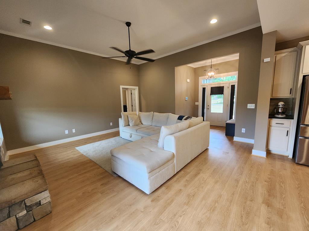 152 McLendon Road Fort Mitchell, AL 36856 - Photo 4 of 27 a living room with furniture and a chandelier