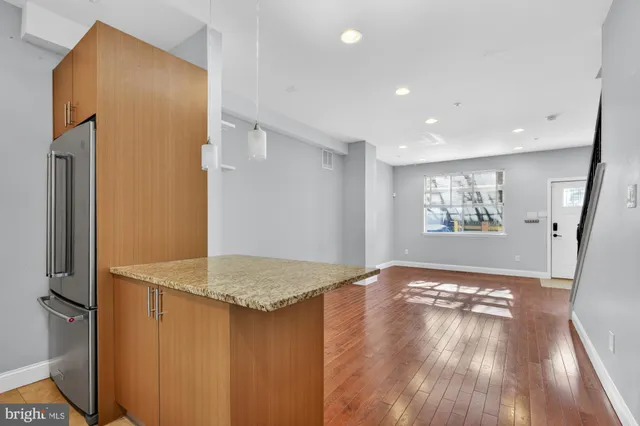 a view of livingroom with hardwood floor and hallway